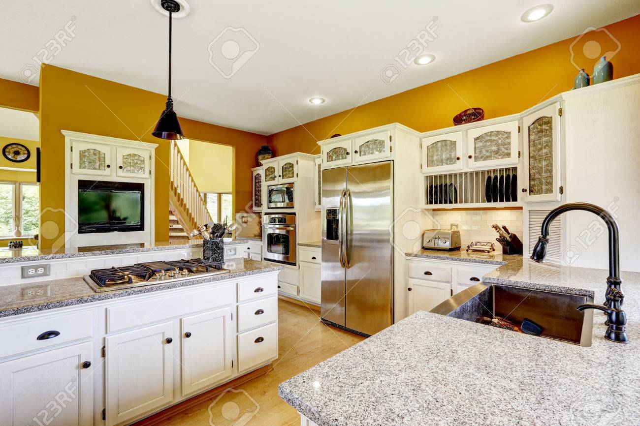 light yellow kitchen with white cabinets farm house interior luxury kitchen room in bright yellow color light yellow kitchen with white cabinets farm house interior luxury kitchen room in bright yellow color