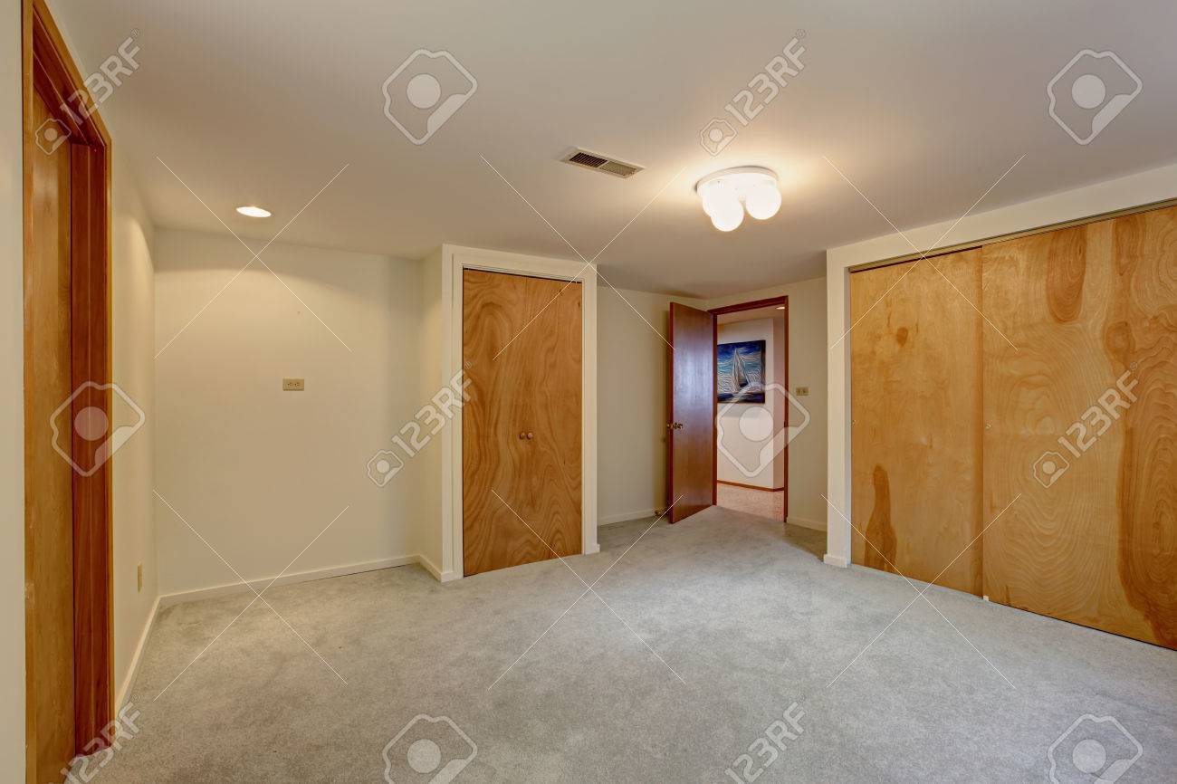 Empty Basement Room With Closets Wooden Sliding Doors Stock Photo