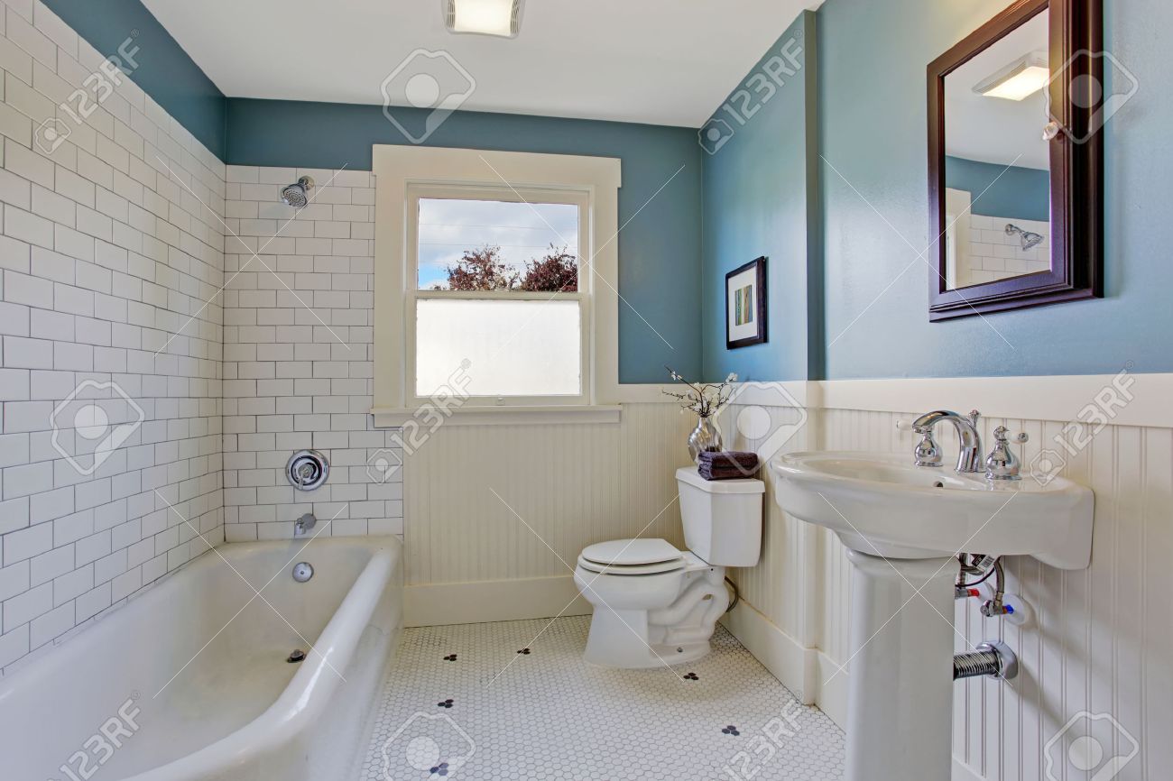 bathroom interior with blue wall and white plank panel trim bathroom interior with blue wall and white plank panel trim