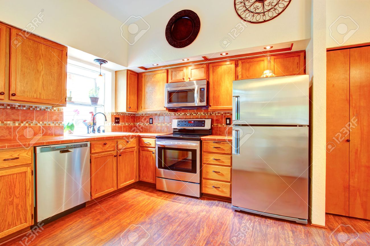 kitchen room with orange tile back splash trim, maple cabinets kitchen room with orange tile back splash trim, maple cabinets