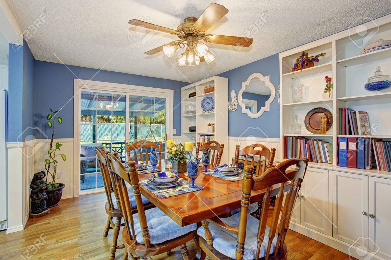 Beautifully Decorated Dinning Room With Sliding Glass Door And