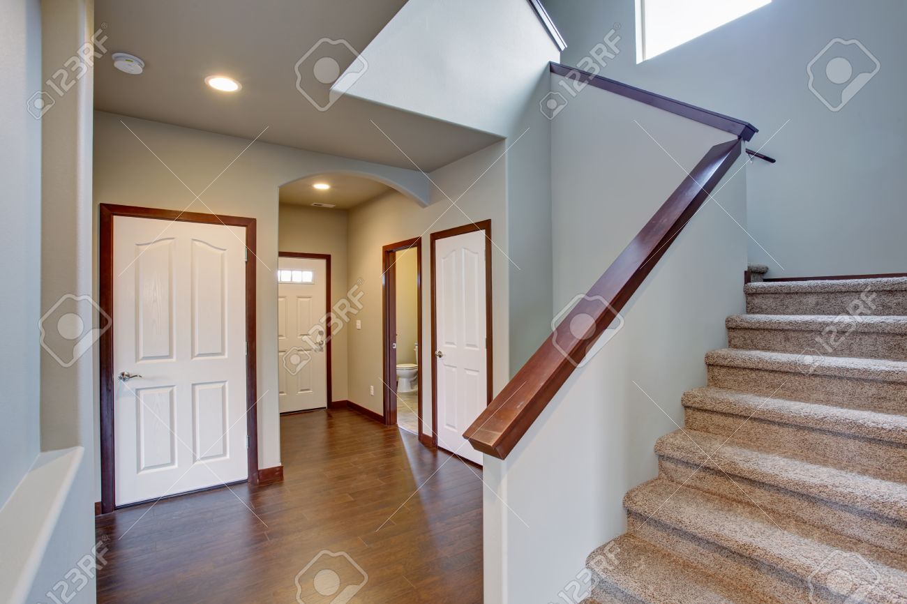 Elegant Hallway With Stairs, Hardwood Floor, And Lovely Dark Elegant Hallway With Stairs, Hardwood Floor, And Lovely Dark