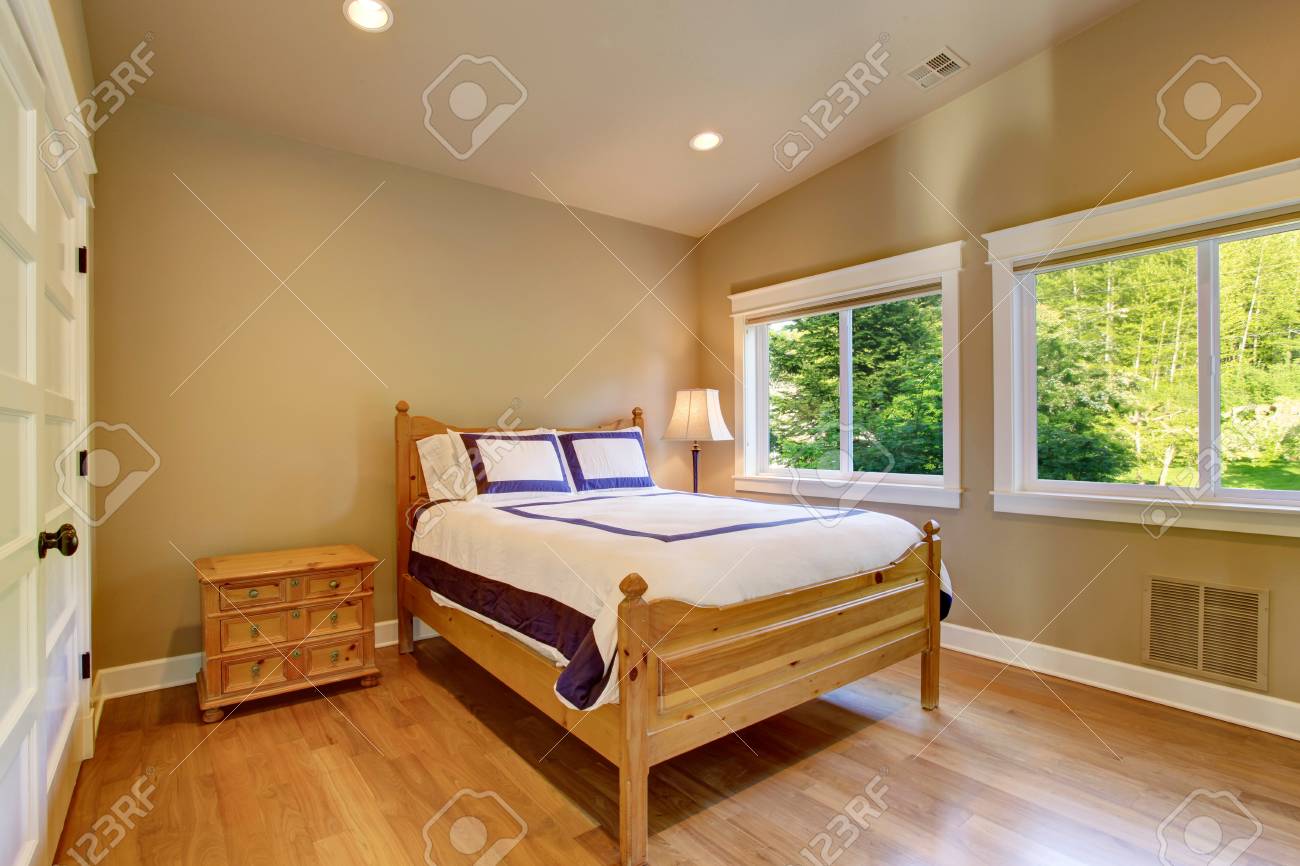 Simple Beige Bedroom Interior With Light Brown Nightstand Hardwood Stock Photo Picture And Royalty Free Image Image 59953128