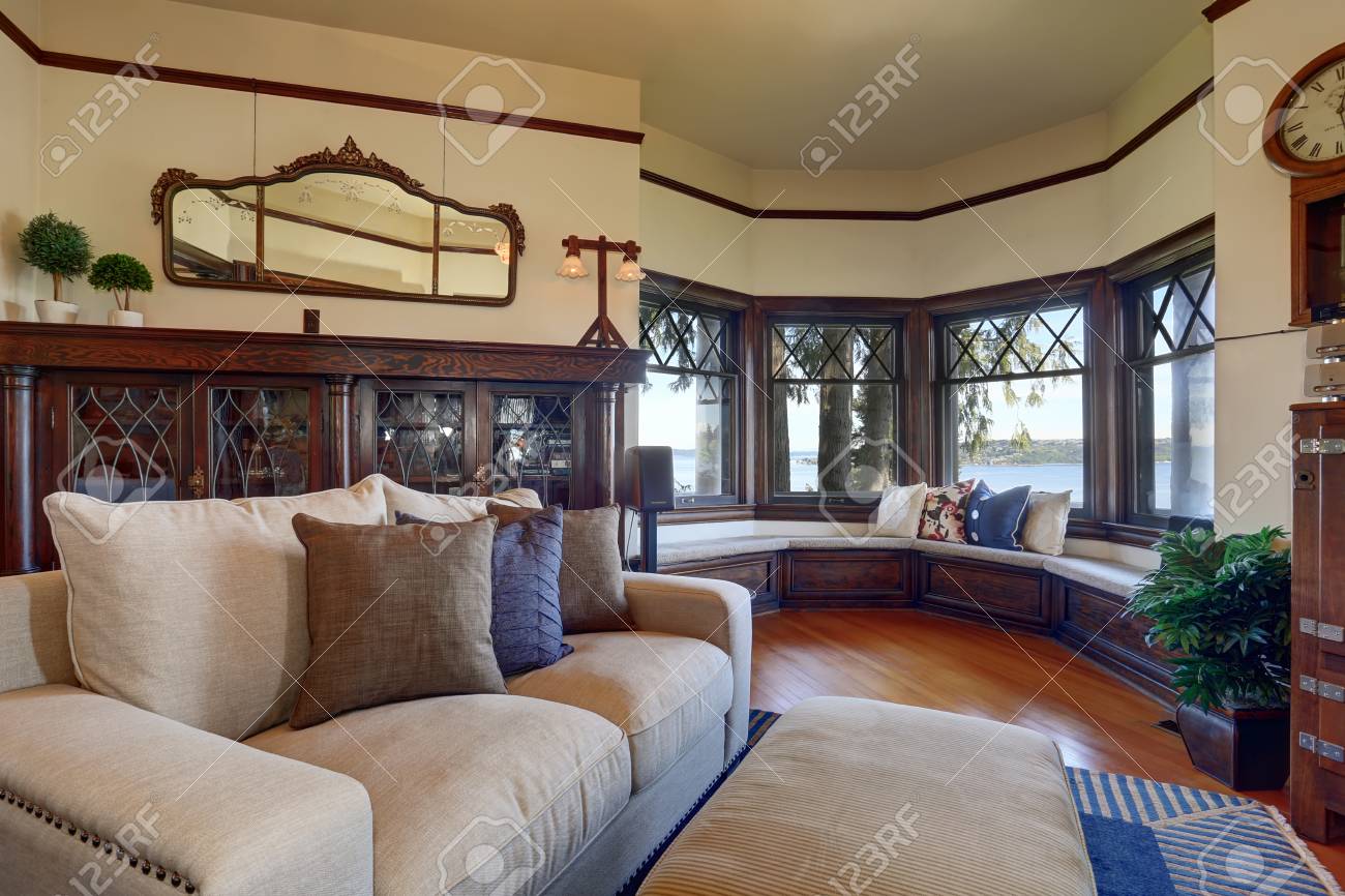 Vintage Style Living Room With Beige Sofa And Antique Wooden Stock Photo