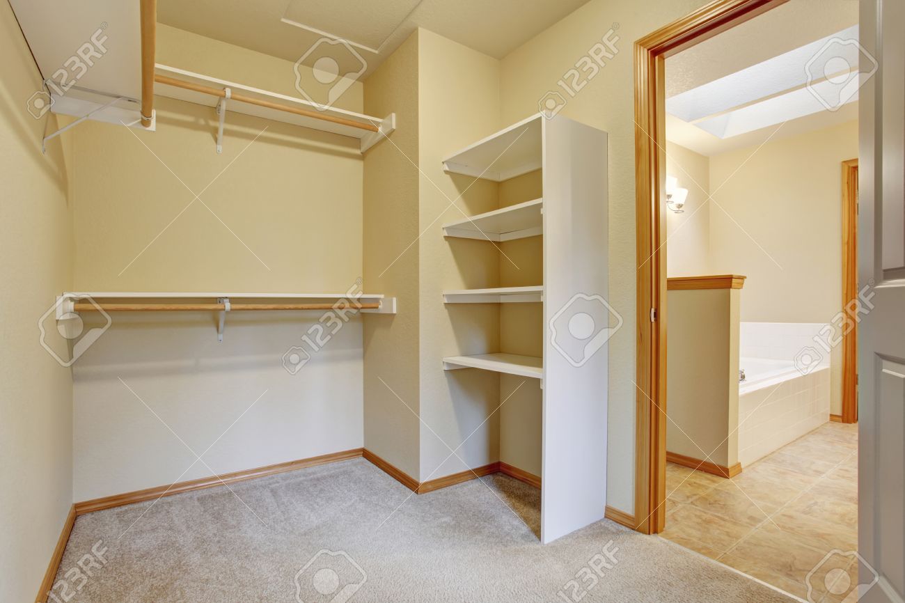 empty walk in closet white bright empty walkin closet with wood shelves beige carpet floor stock photo empty walkin closet with wood shelves beige carpet floor empty walk in closet white bright empty walkin closet with wood shelves beige carpet floor stock photo empty walkin closet with wood shelves beige carpet floor