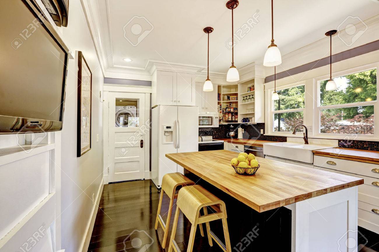 Kitchen Interior In White Tones With Hardwood Counter Top Kitchen Stock Photo Picture And Royalty Free Image Image 60405442