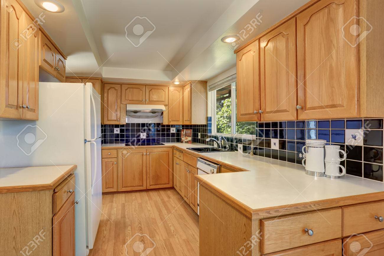 Kitchen Room Interior With Light Brown Cabinets White Appliances