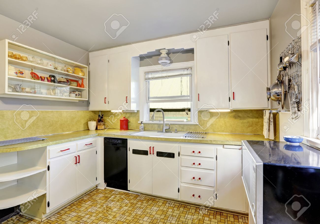 Old Fashioned Kitchen With White Cabinets