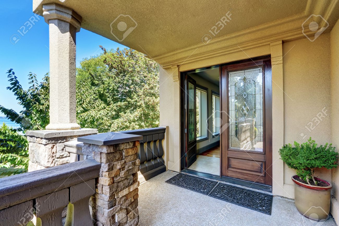 Luxury House Front luxury house exterior. entrance column porch with railings and Luxury House Front luxury house exterior. entrance column porch with railings and