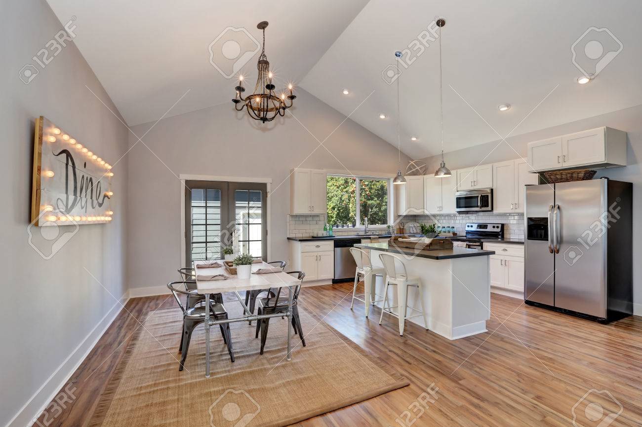 Interior Of Kitchen And Dining Room With High Vaulted Ceiling