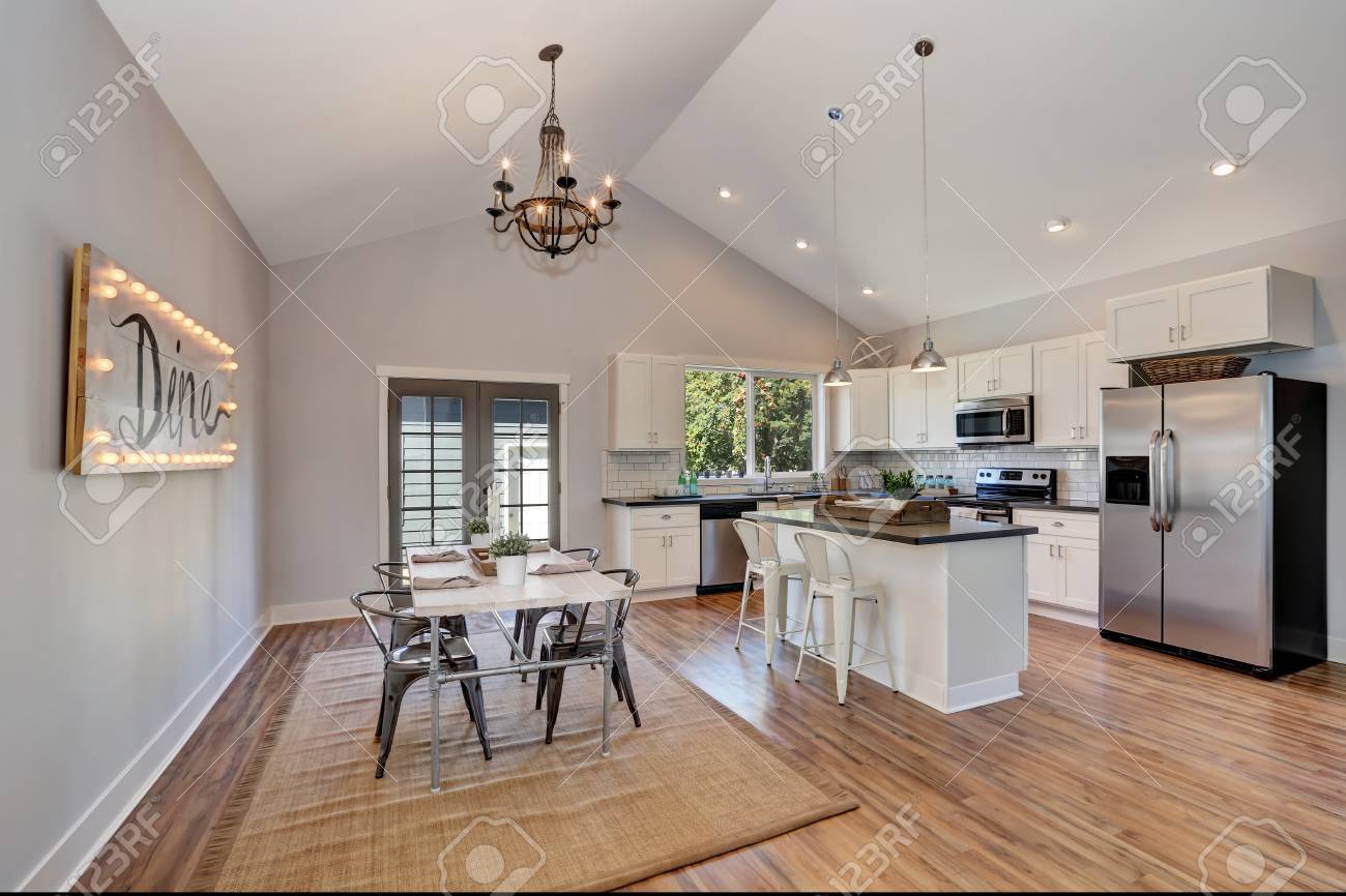 Interior Of Kitchen And Dining Room With High Vaulted Ceiling