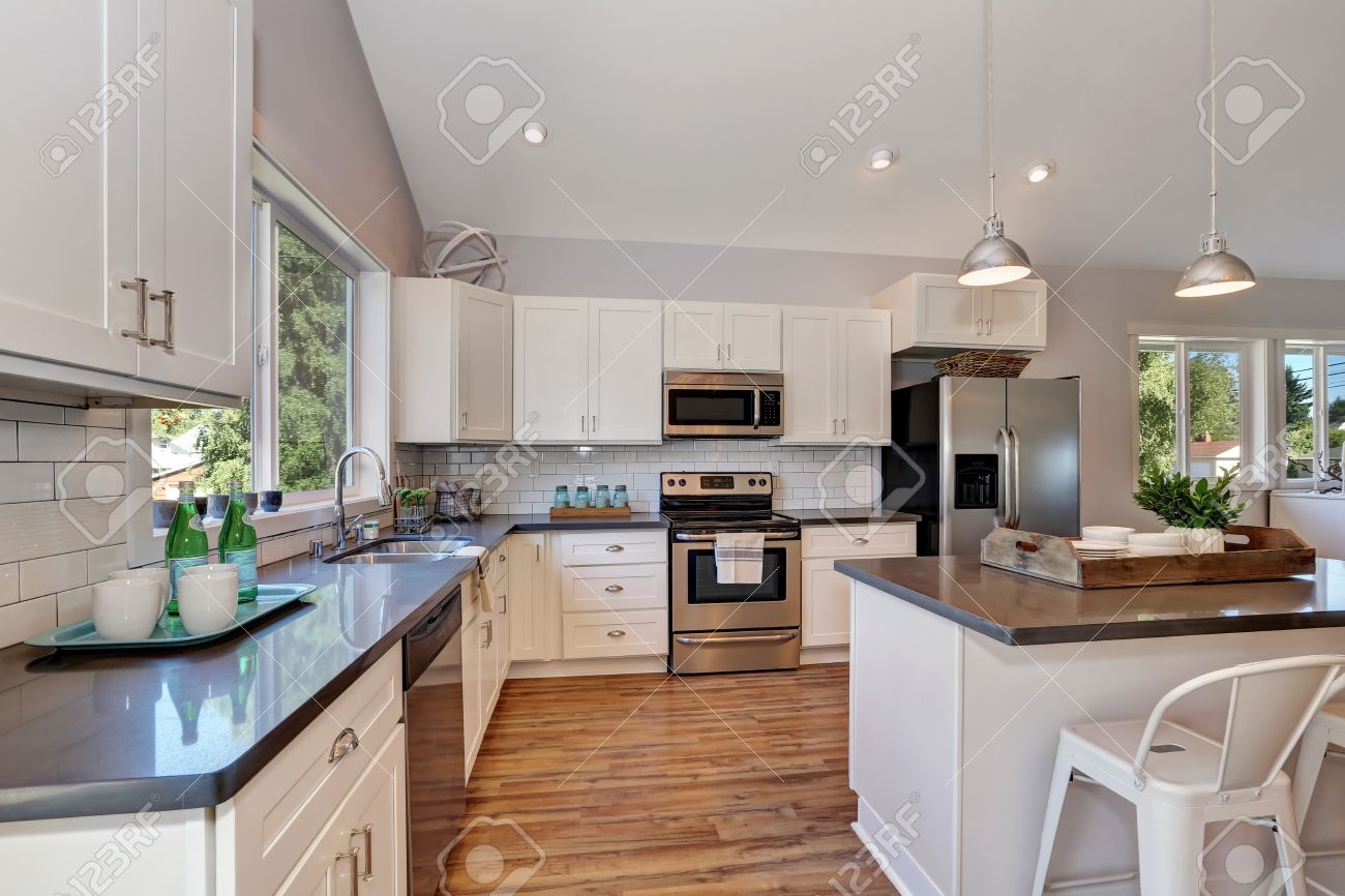 White Kitchen Vaulted Ceiling interior of kitchen with high vaulted ceiling, pendant lights White Kitchen Vaulted Ceiling interior of kitchen with high vaulted ceiling, pendant lights