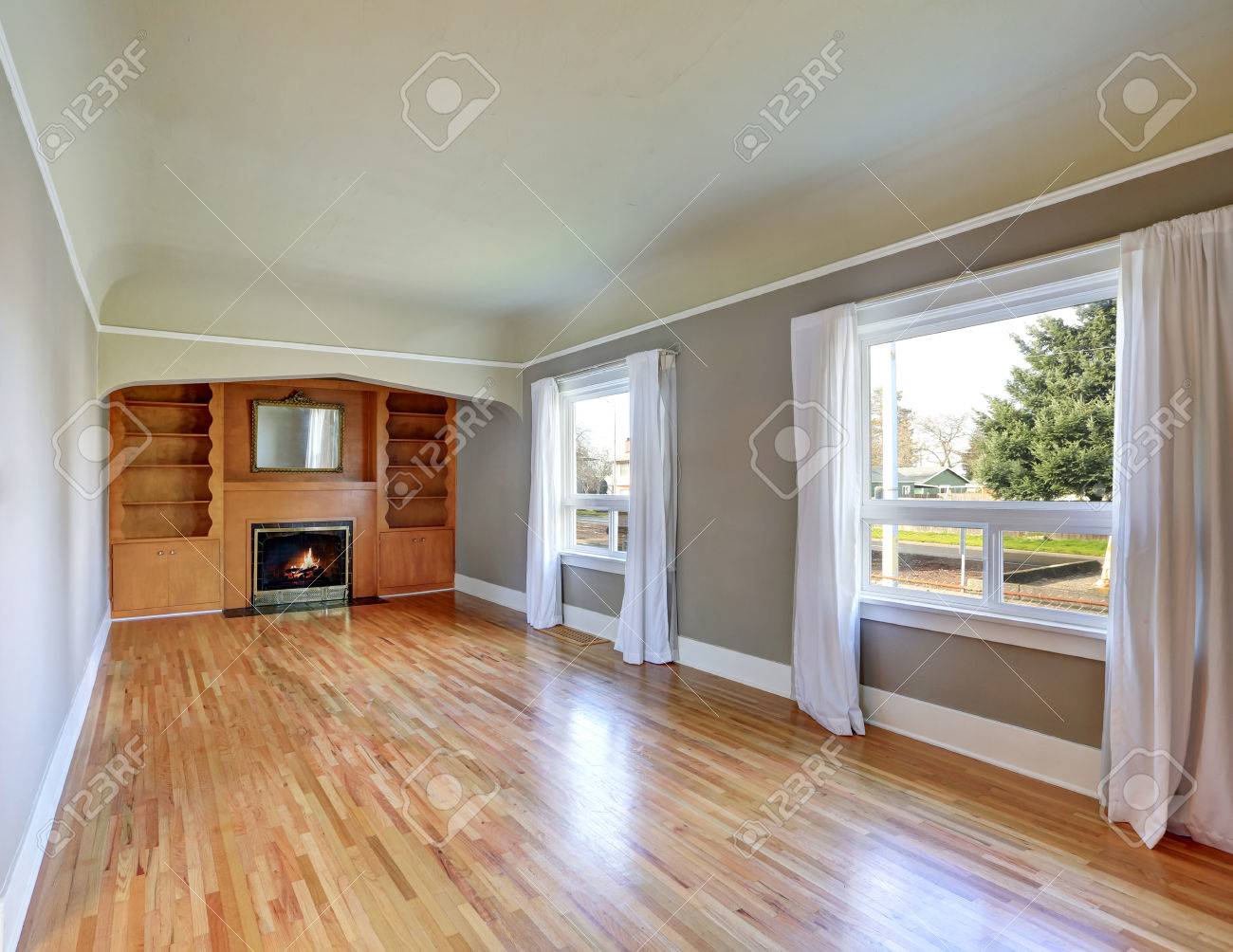 unfurnished living room interior in old craftsman house. gray unfurnished living room interior in old craftsman house. gray