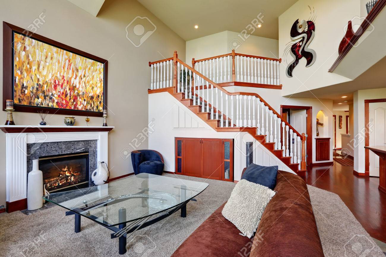 American Living Room With High Vaulted Ceiling And Staircase ... American Living Room With High Vaulted Ceiling And Staircase ...