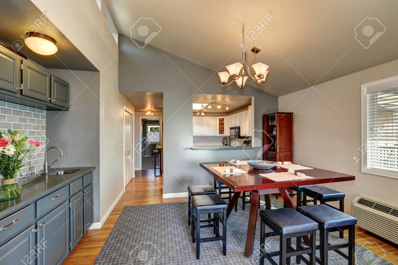 Apartment House Dining Room Interior In Gray Colors With Hardwood