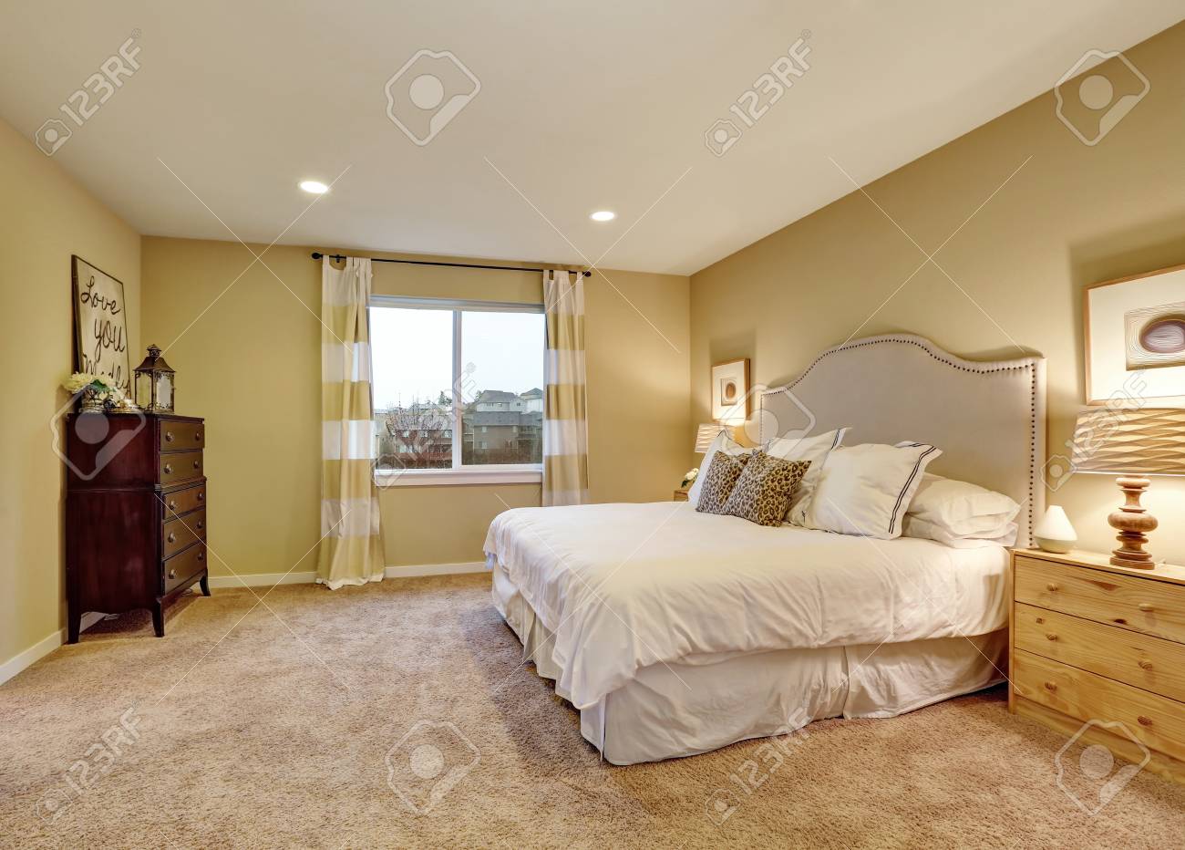 Master Bedroom Interior With Large Bed Chest Of Drawers And