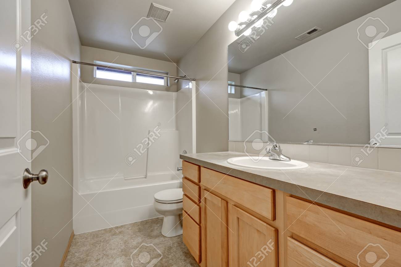Grey Bathroom Interior With Wood Vanity Cabinet And Shower And Stock Photo Grey Bathroom Interior With Wood Vanity Cabinet And Shower And Stock Photo