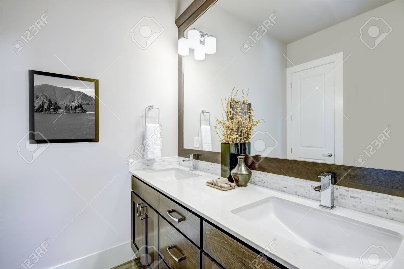 Lovely Bathroom Features Dark Brown Vanity Cabinet With Double