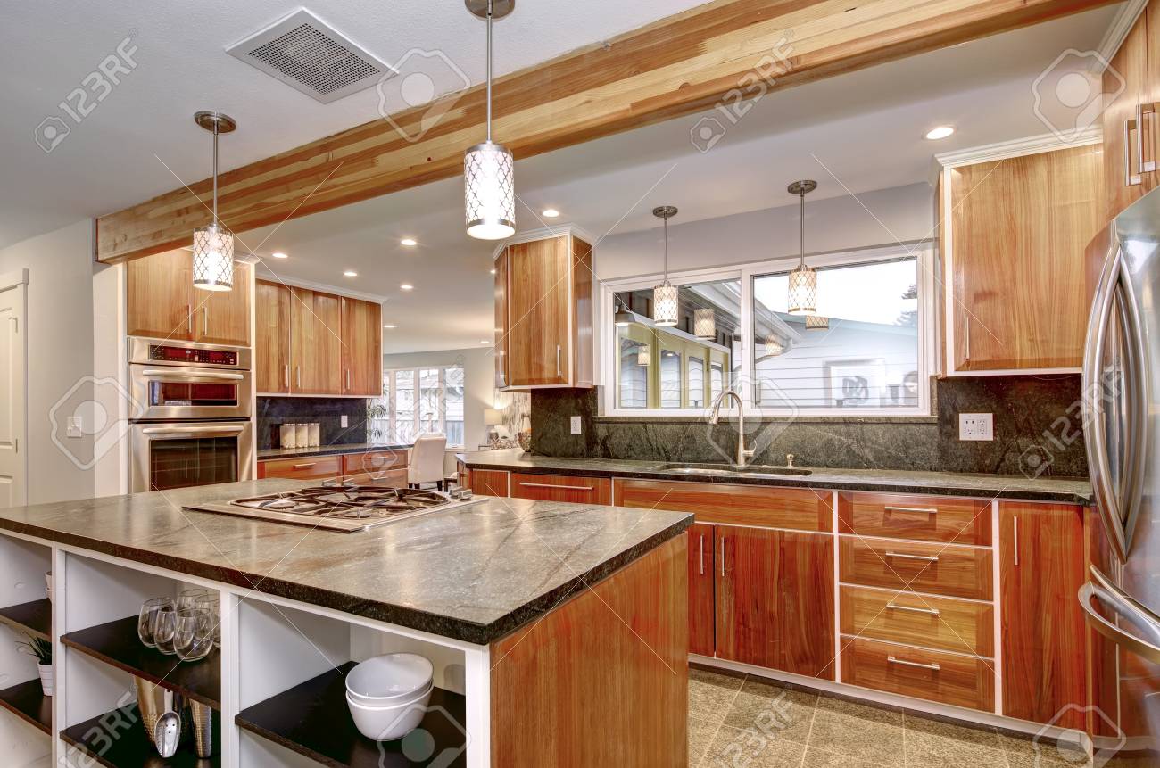 Luxurious Kitchen Room With Dark Gray Counter Tops Wooden