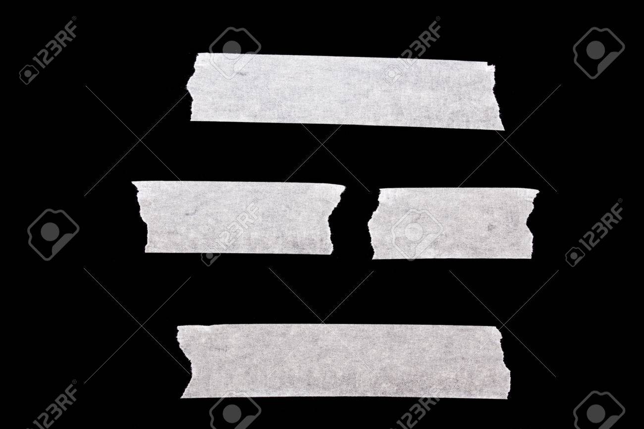 黒の背景に分離された白のマスキング テープ の写真素材 画像素材