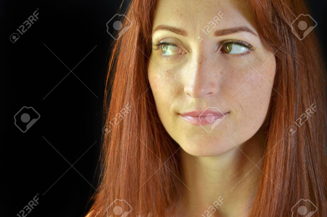 White Girl With Red Hair And Green Eyes With Eyelash Extensions