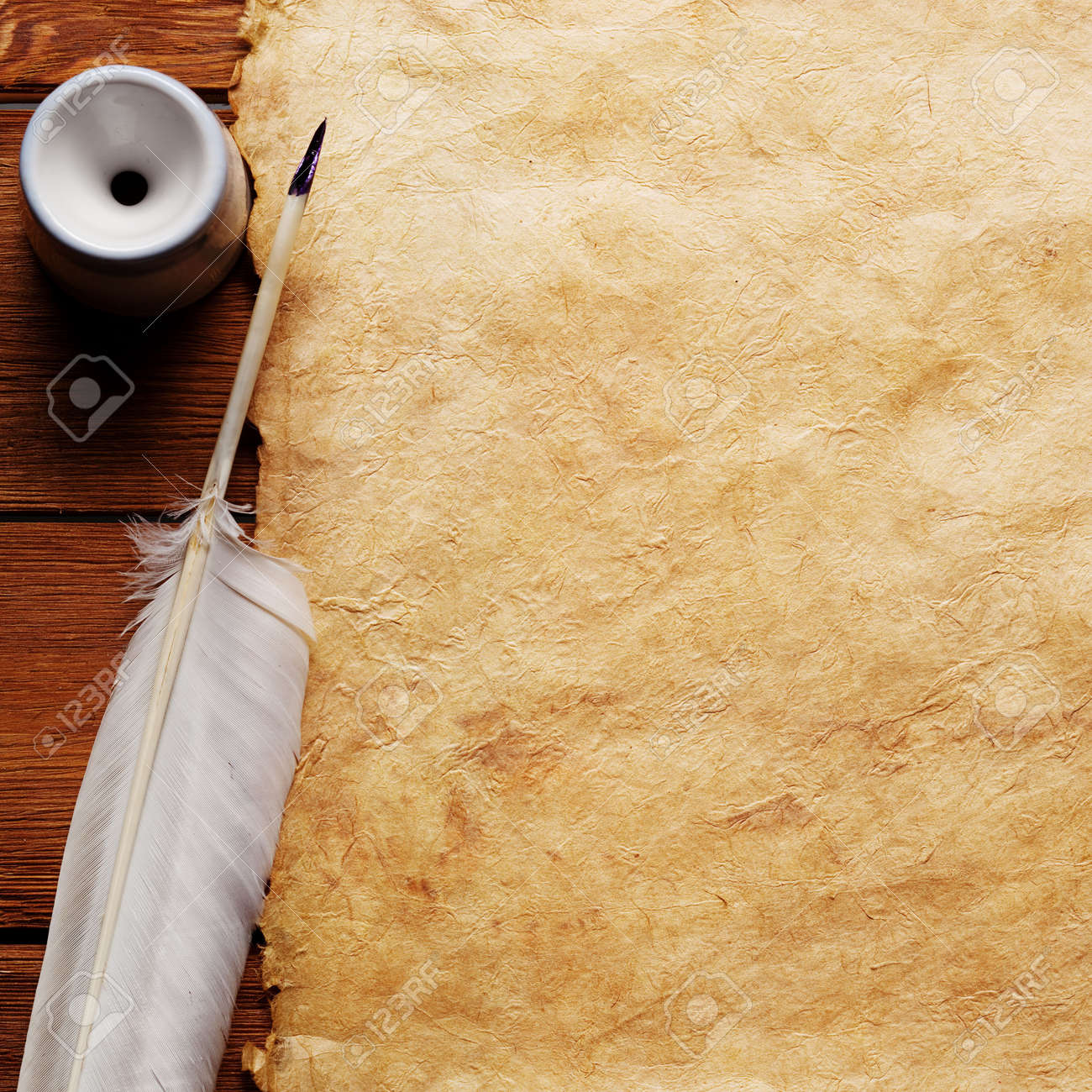 inkwell and feather on a background of the empty form for the