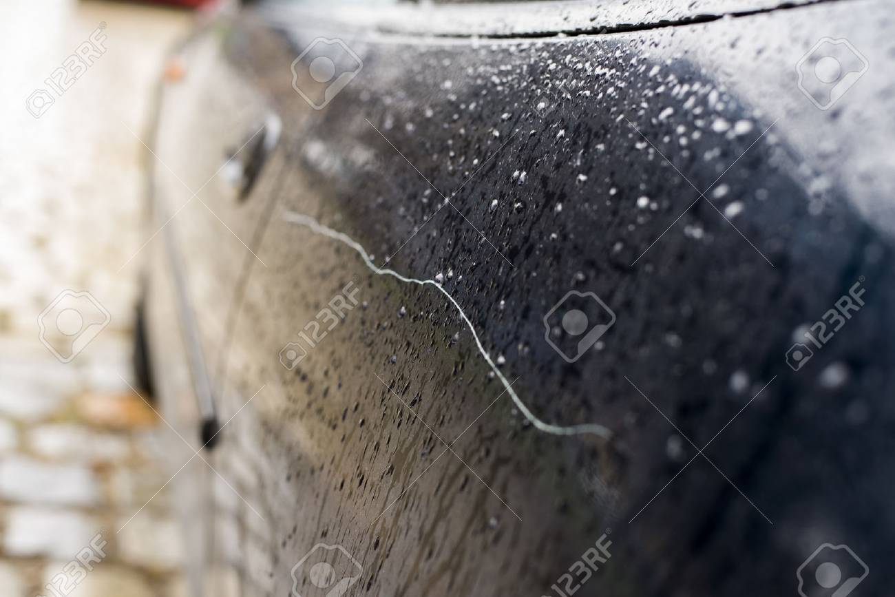 Scratched car paint with door handle and tire out of focus - 36583386 Scratched car paint with door handle and tire out of focus - 36583386