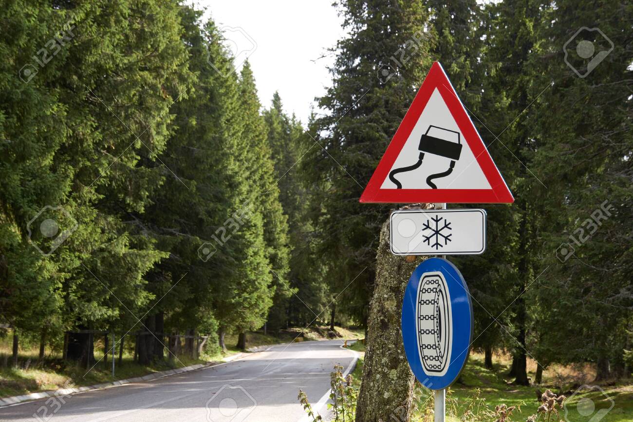 Road Signs On A Mountain Road Warning Sign Slippery Road Surface Stock Photo Picture And Royalty Free Image Image