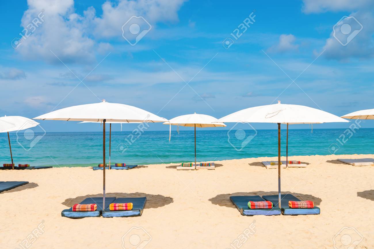 white idyllic beach parasol