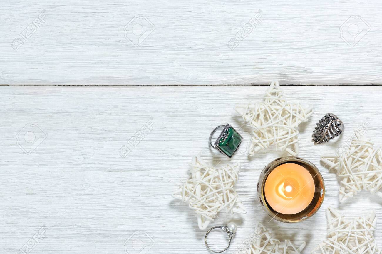 Burning Candle In A Golden Candle Holder Rings And Christmas Stock Photo Picture And Royalty Free Image Image 150047798
