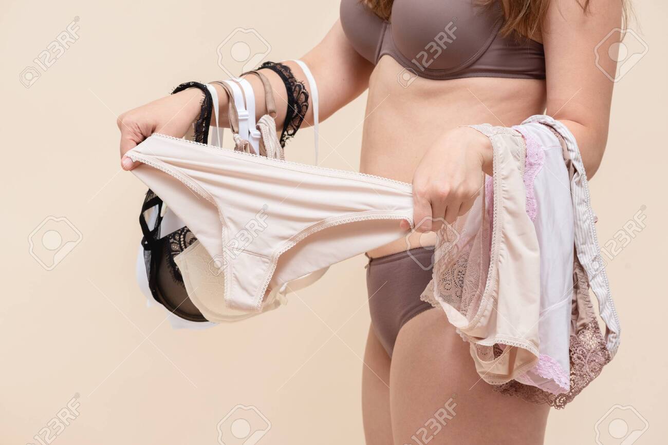 Woman Is Choosing A New Panties In The Fitting Room Concept. Stock Photo,  Picture and Royalty Free Image. Image 154087951.