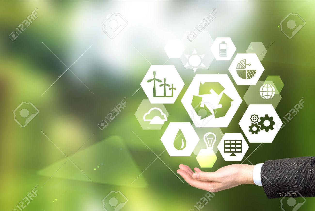 hand holding signs of different green sources of energy in hexahedron shape, a 'reduce, reuse, recycle' sign in the centre. Blurred green background. Concept of clean environment. - 51594041 hand holding signs of different green sources of energy in hexahedron shape, a 'reduce, reuse, recycle' sign in the centre. Blurred green background. Concept of clean environment. - 51594041