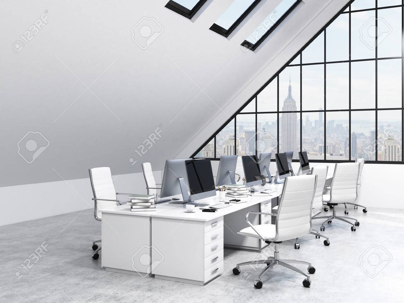 two rows of tables leading to the panoramic window in an office