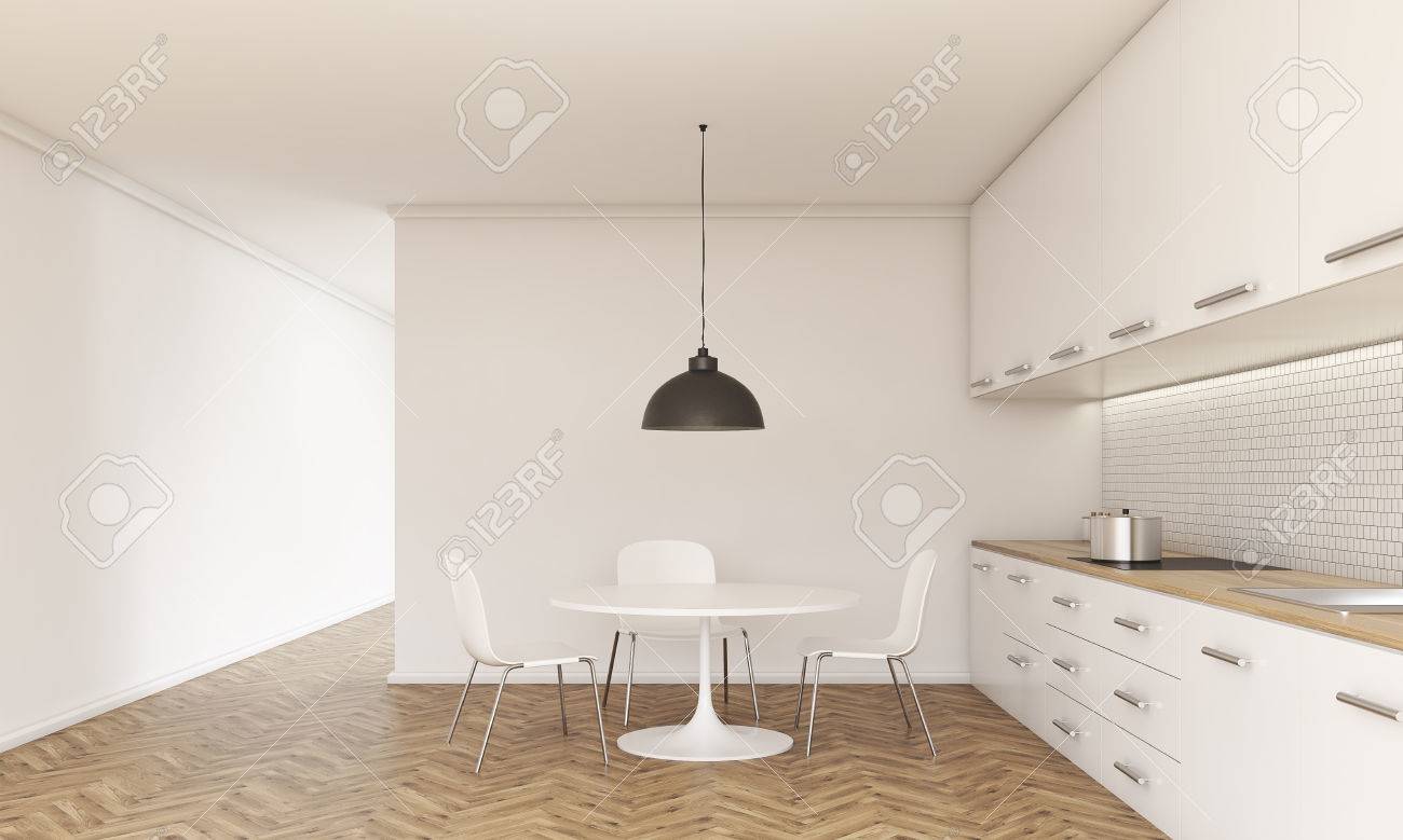Vista Frontal Del Interior De La Cocina Con Una Pequeña Mesa De ... Vista Frontal Del Interior De La Cocina Con Una Pequeña Mesa De ...