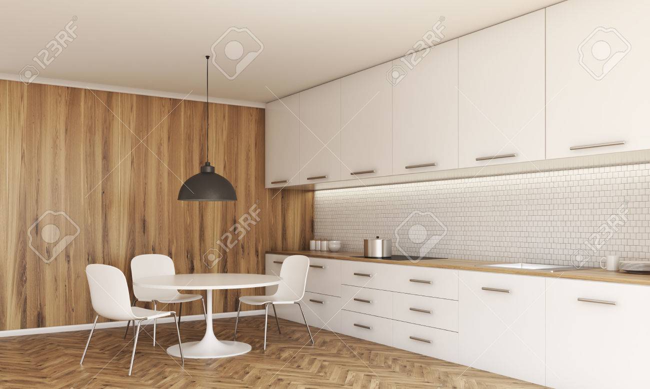 Vista Lateral De Entre Cocina Con Una Pequeña Mesa De Comedor Y ... Vista Lateral De Entre Cocina Con Una Pequeña Mesa De Comedor Y ...