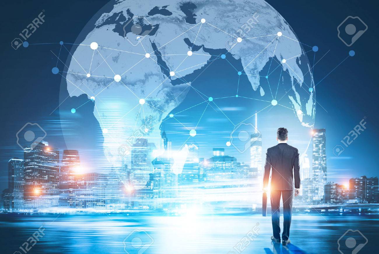 Back view of businessman in night city looking at globe with network. Global networking and international business concept - 70384747 Back view of businessman in night city looking at globe with network. Global networking and international business concept - 70384747