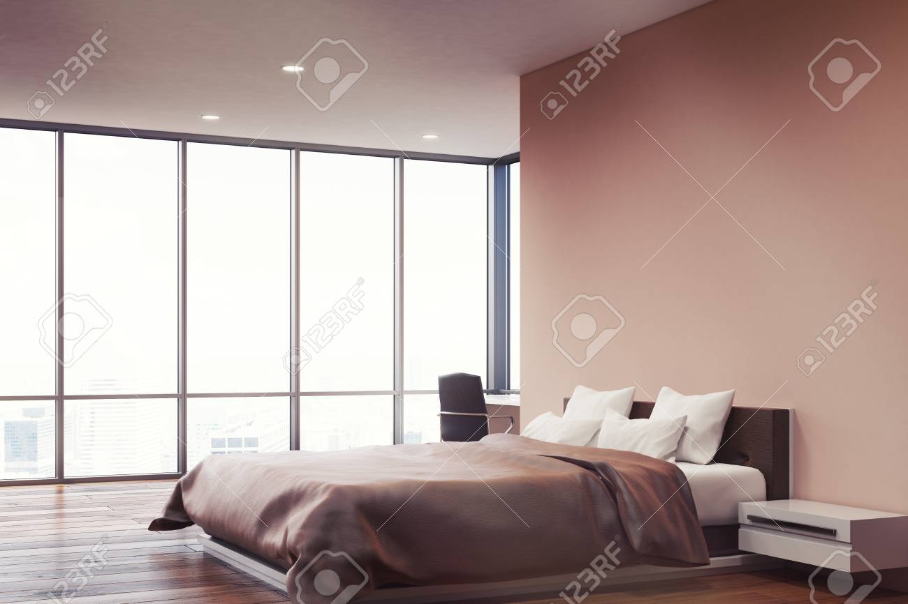 Side View Of A Bedroom With Pink Walls A Double Bed With Two
