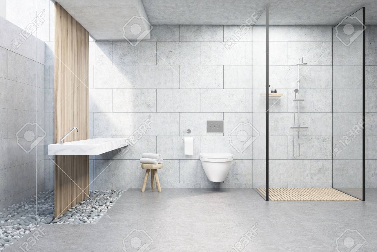 bathroom interior with gray brick walls, a shower cabin with bathroom interior with gray brick walls, a shower cabin with