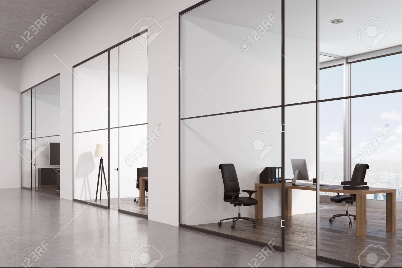 Side View Of An Office Corridor With A Row Of Rooms With Glass