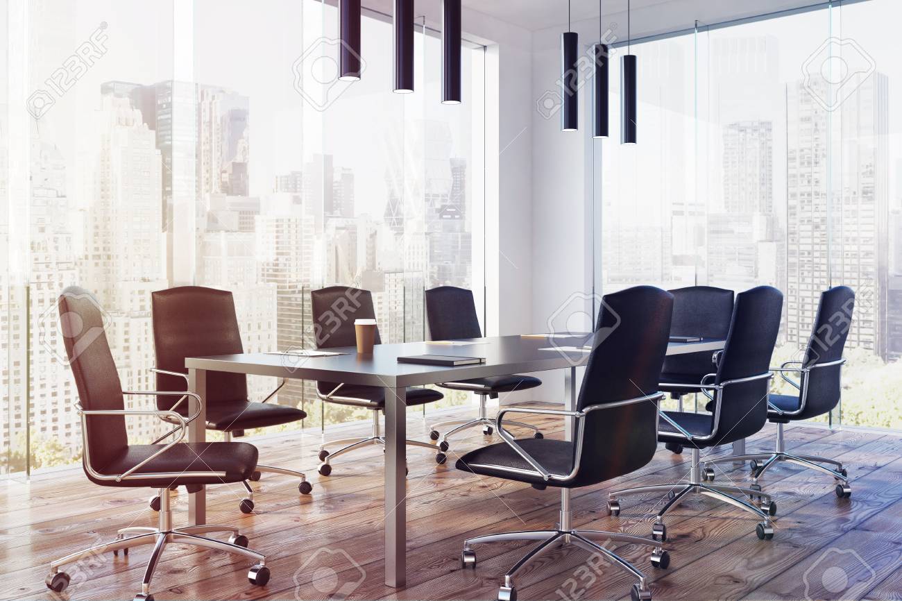 corner of a modern meeting room interior with a long table black
