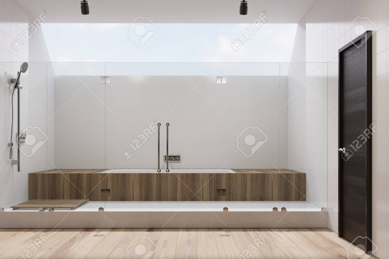 White Tiled Bathroom Interior With Wooden Cabinets A Built In Stock Photo Picture And Royalty Free Image Image 82057323