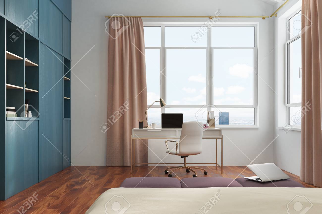 White Bedroom Interior With A Double Bed A Computer Desk With