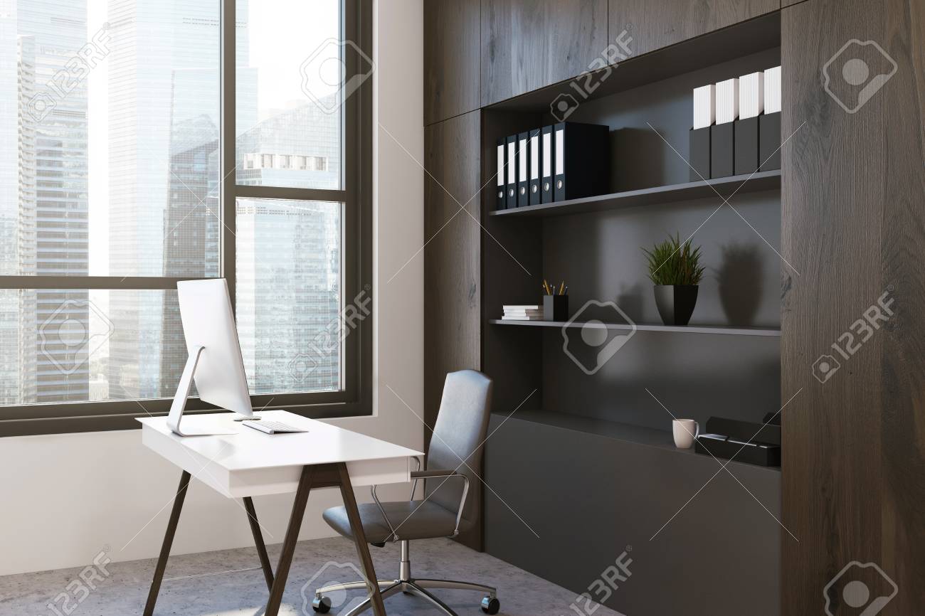 dark wood office workplace with a bookcase a large window a dark wood office