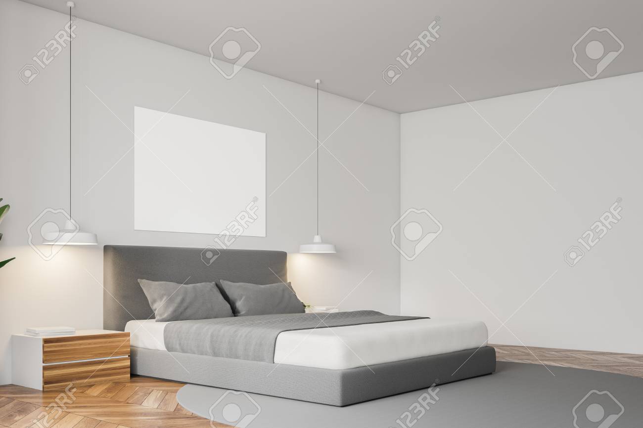 Corner Of White Wall Minimalistic Bedroom With A Wooden Floor