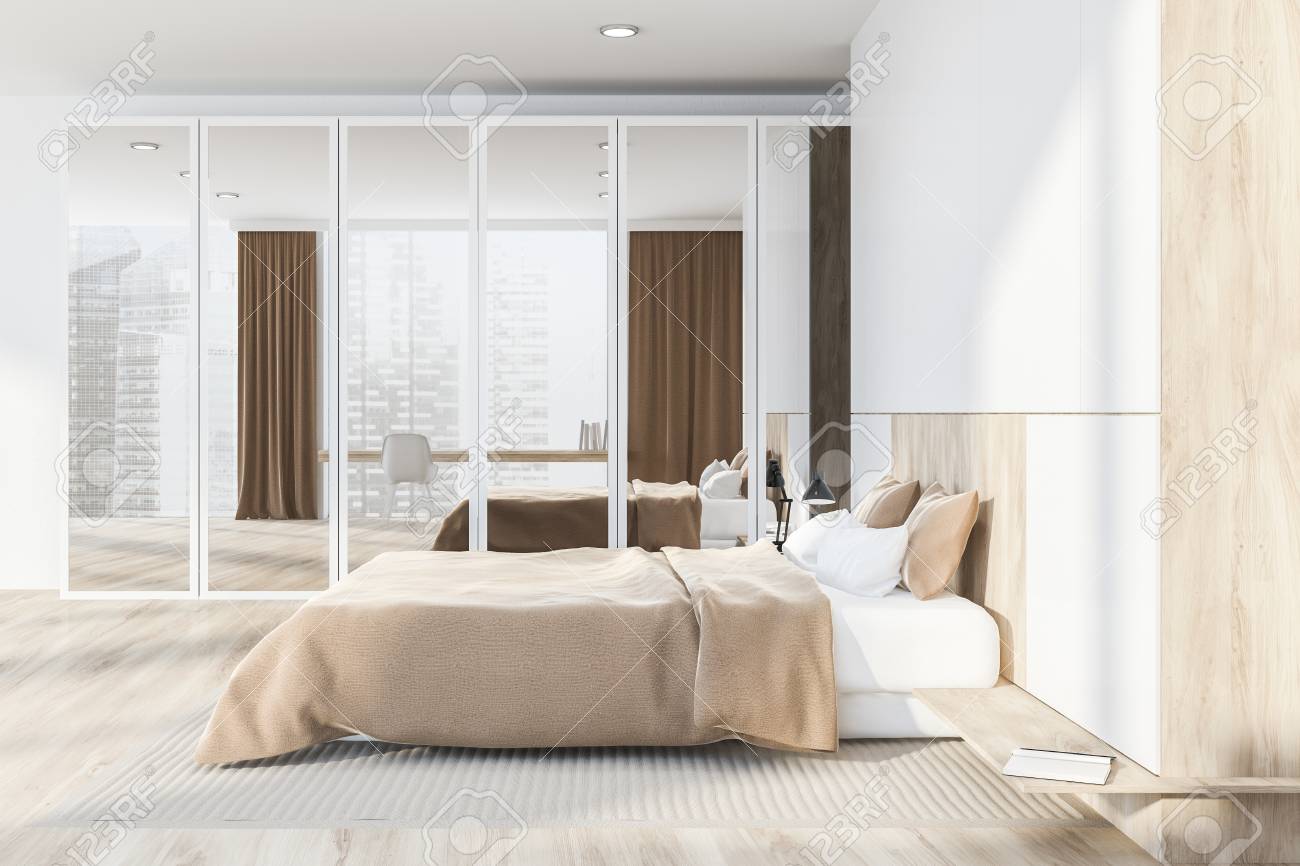 Side View Of Master Bedroom With White Walls Wooden Floor Master
