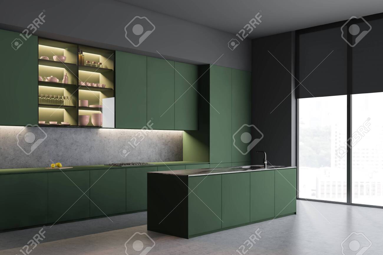 Corner Of Gray Kitchen With Concrete Floor Green Cabinets And