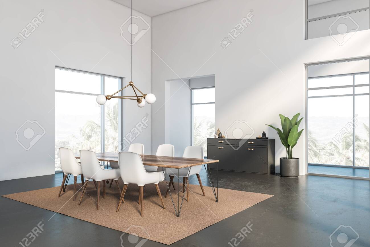 Corner Of Luxury Dining Room With White Walls Concrete Floor