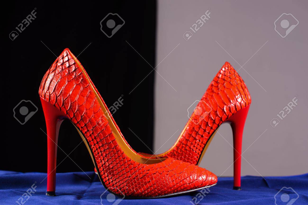 red snakeskin pumps