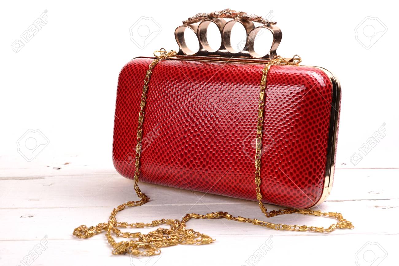 Red Wallet Purse With Brass Knuckles On White Background. Stock Photo,  Picture and Royalty Free Image. Image 81147457.