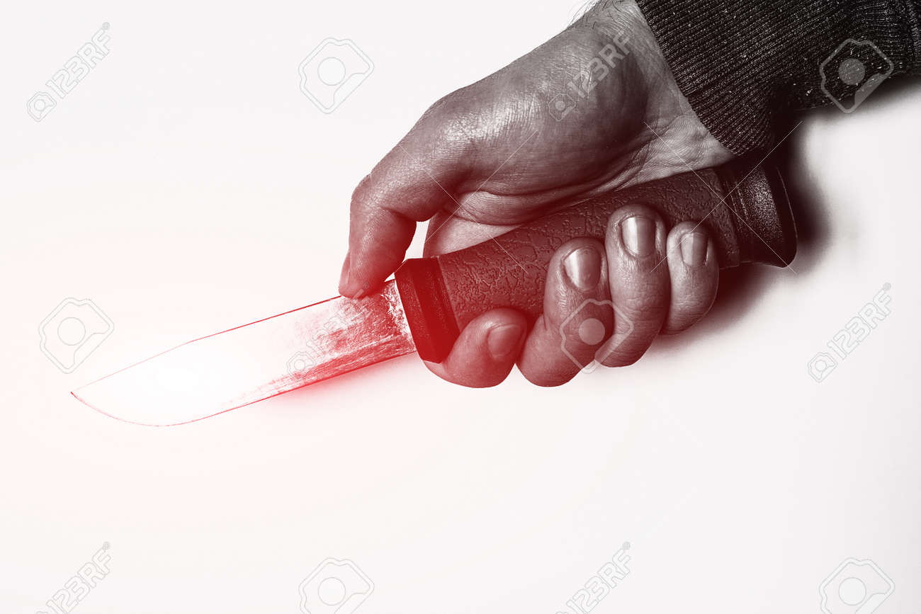 holding knife in hand with red glow concept crime - 166172229 holding knife in hand with red glow concept crime - 166172229
